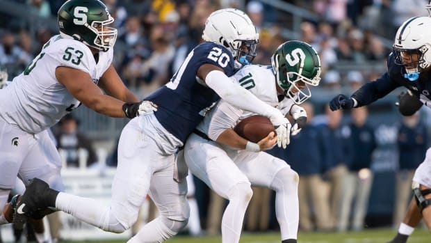 Penn State defensive end Adisa Isaac sacks Michigan State quarterback Payton Thorne.